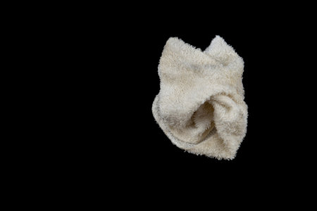 Dirty rag isolated on black background.