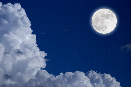 Full moon with starry and clouds blurred background. Romantic night.の写真素材