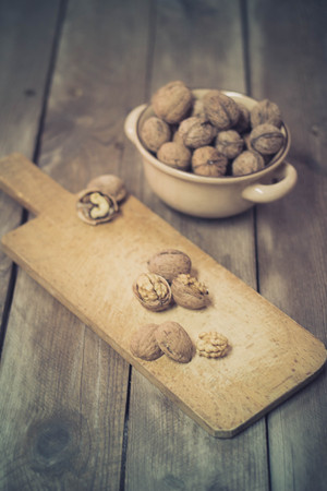 Walnuts on an old wooden tableの写真素材