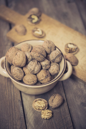 Walnuts on an old wooden tableの写真素材