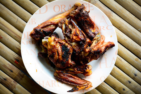 Grilled chicken on plate on bamboo backgroundの写真素材