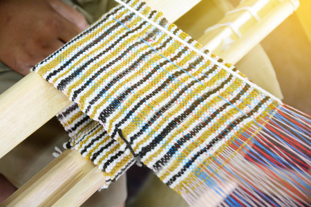 weave yarn on the manual wood loom  handicraft (Saori) ,thailand,selective focusの写真素材