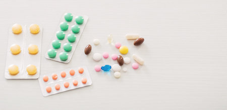 pills on white wooden table