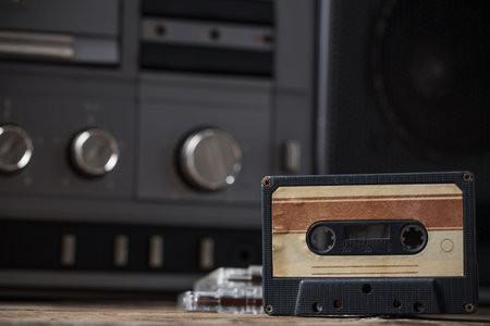 old tape recorder and cassette on  wooden table