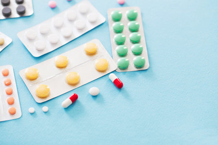 pills in blisters  on blue background