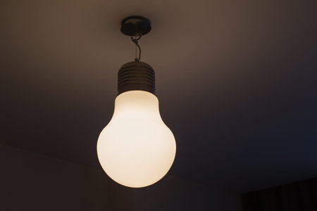 light bulb on white ceiling