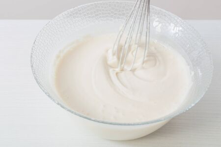 dough in  glass plate on  white backgroundの写真素材