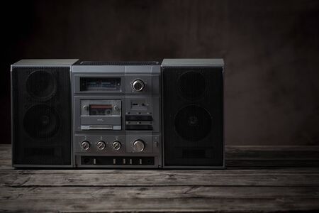 old tape recorder and cassette on  wooden tableの写真素材