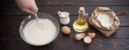 dough  and products for its preparation on  dark wooden backgroundの写真素材