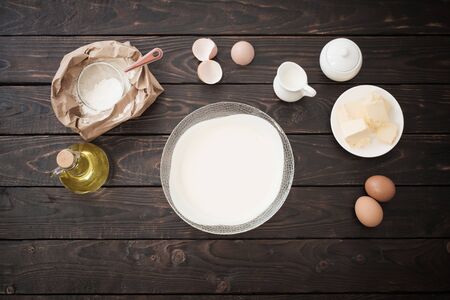 dough  and products for its preparation on  dark wooden backgroundの写真素材