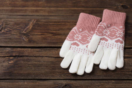 gloves on old wooden backgroundの写真素材