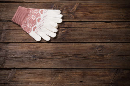 gloves on old wooden backgroundの写真素材