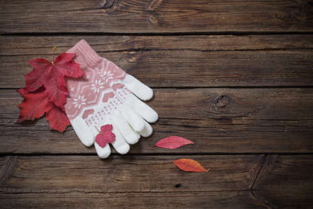gloves on old wooden backgroundの写真素材