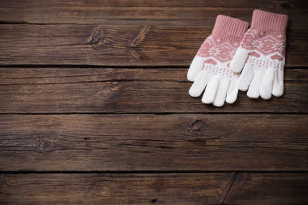 gloves on old wooden backgroundの写真素材