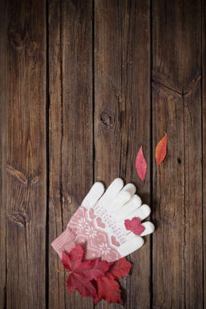 gloves on old wooden backgroundの写真素材