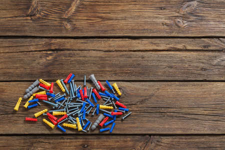 group of dowels on dark wooden backgroundの写真素材