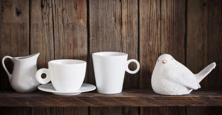 white kitchen dishware on old dark wooden backgroundの写真素材