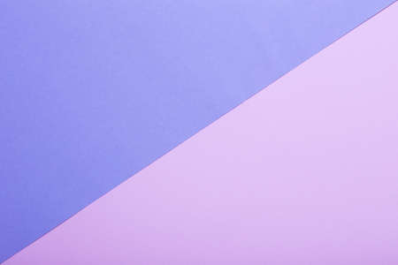 two sheets of colored paper diagonallyの写真素材