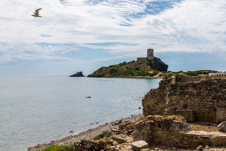 Ancient Sardinian ruins of Nora, Sardinia, ancient spanish tower of Coltellazzo, Pula, Sardegna, Italyの写真素材