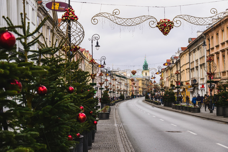Warsaw, Poland - December 25th, 2016. Christmas decorations on Nowy Swiat street in Warsaw Old town at Xmas day.のeditorial素材