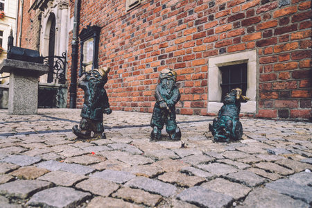 Wroclaw, Poland - September, 19th, 2016. Disabled dwarfs statues at Wroclaw Market square near Old Town hall. Bronze gnome sculptures are the main tourist attraction and symbol of the city.のeditorial素材