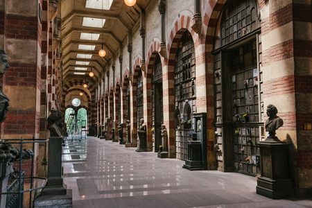 June 14th, 2017 - Milan, Lombardy, Italy. Monumental Cemetery, also known as Cimitero Monumentale di Milano. Inner gallery and columbarium in Famedio chapel - main entrance to historical graveyard.のeditorial素材