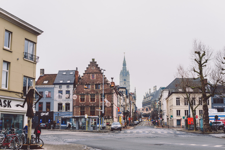 Ghent, Belgium - January 1th, 2017. Medieval flemish city Gent empty streets with old merchant houses, Christmas decorations and Belfry tower after New Year celebration.のeditorial素材