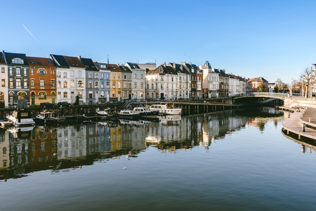 December, 27th, 2016 - Ghent, East Flanders, Belgium. Portus Ganda marina with colorful belgian houses, private boats and barges in docks reflected on the water of canal in flemish city Gent.のeditorial素材