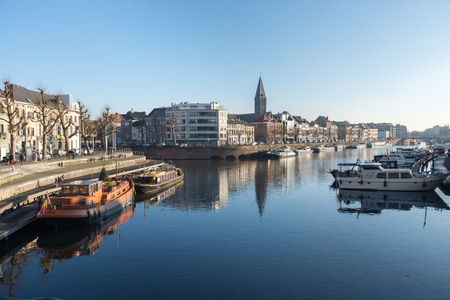 December, 30th, 2016 - Ghent, East Flanders, Belgium. Portus Ganda marina with colorful belgian houses, private boats and barges in docks reflected on the water of canal in flemish city Gent.のeditorial素材