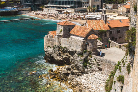May, 30th, 2016 - Budva, Montenegro. Budva Old town beach and Citadele stone fortress with stone barracks and walls. Adriatic coast view.のeditorial素材