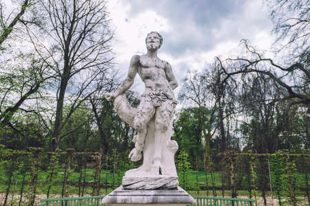 April, 14th, 2017 - Potsdam, Brandenburg, Germany. Antique greek sculpture of satyr in Sanssouci park in Potsdam.のeditorial素材
