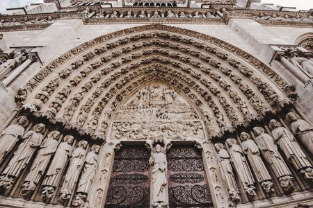 Paris, France - August 16, 2017. Portal of the last judgment - main entrance of Notre Dame de Paris. Central doorway depicting the Last Judgment and biblical scenes.のeditorial素材