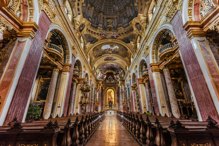 Vienna, Austria - December 31, 2017. Interior of Jesuit Church or University church with marble pillars, gilding and frescoes. Baroque parish with illusionistic vault ceiling, general inside view.のeditorial素材