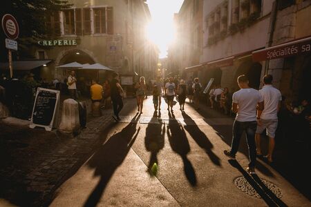 Long Shadows of People Walking at Sunsetのeditorial素材