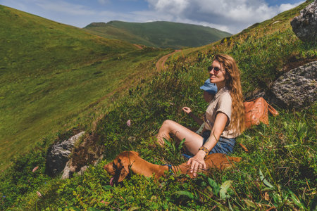 Mother Son and Vizsla Dog Resting in Mountains