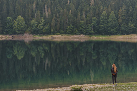 Woman Walking on Lakeside of Black Lake in Durmitor
