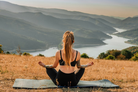 Yoga Woman Sitting in Lotus Pose and Meditatingの写真素材