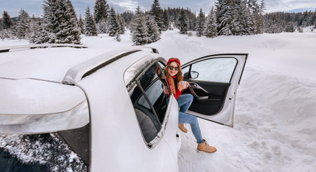 Woman Having Coffee during Winter Road Trip