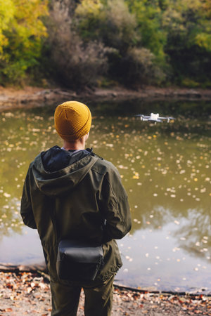 Person Using Remote Control to Fly Small Droneの写真素材