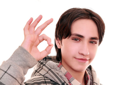 Teenager shows gesture of success の写真素材