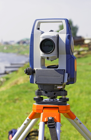 Modern electronic total station, mounted on tripodの写真素材