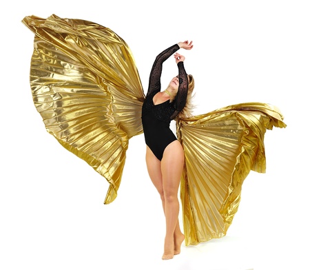 Dancer with golden wings on a white background.Oriental dance.Plastic arts of human body.
の写真素材