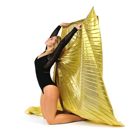 Dancer with golden wings on a white background.Oriental dance.Plastic arts of human body.の写真素材