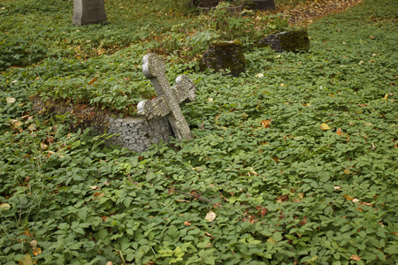 Cemetery. Destruction of the old grave with a crossの写真素材