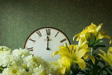 Antique clock with Roman numerals, chrysanthemums and lilies. 12 hours