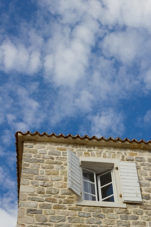 The window on the facade of stone Houseの写真素材