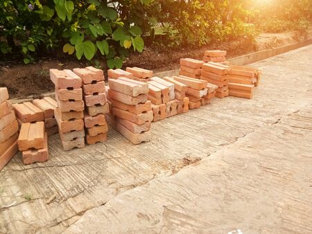Clay bricks placed on concrete floors for use in construction