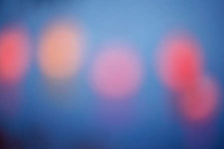 Blurred colorful bokeh lights in the night. Backgrounds for graphic design, Christmas holidays, New...