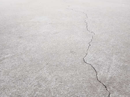 Cracked concrete wall texture, Cement background not painted in vintage style for graphic design or retro wallpaperの写真素材