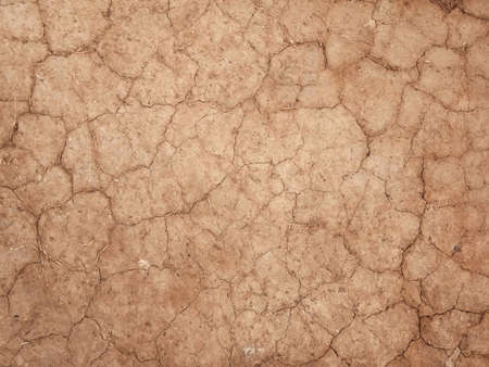 The ground has cracks in the top view for the background or graphic design with the concept of drought and death.の写真素材